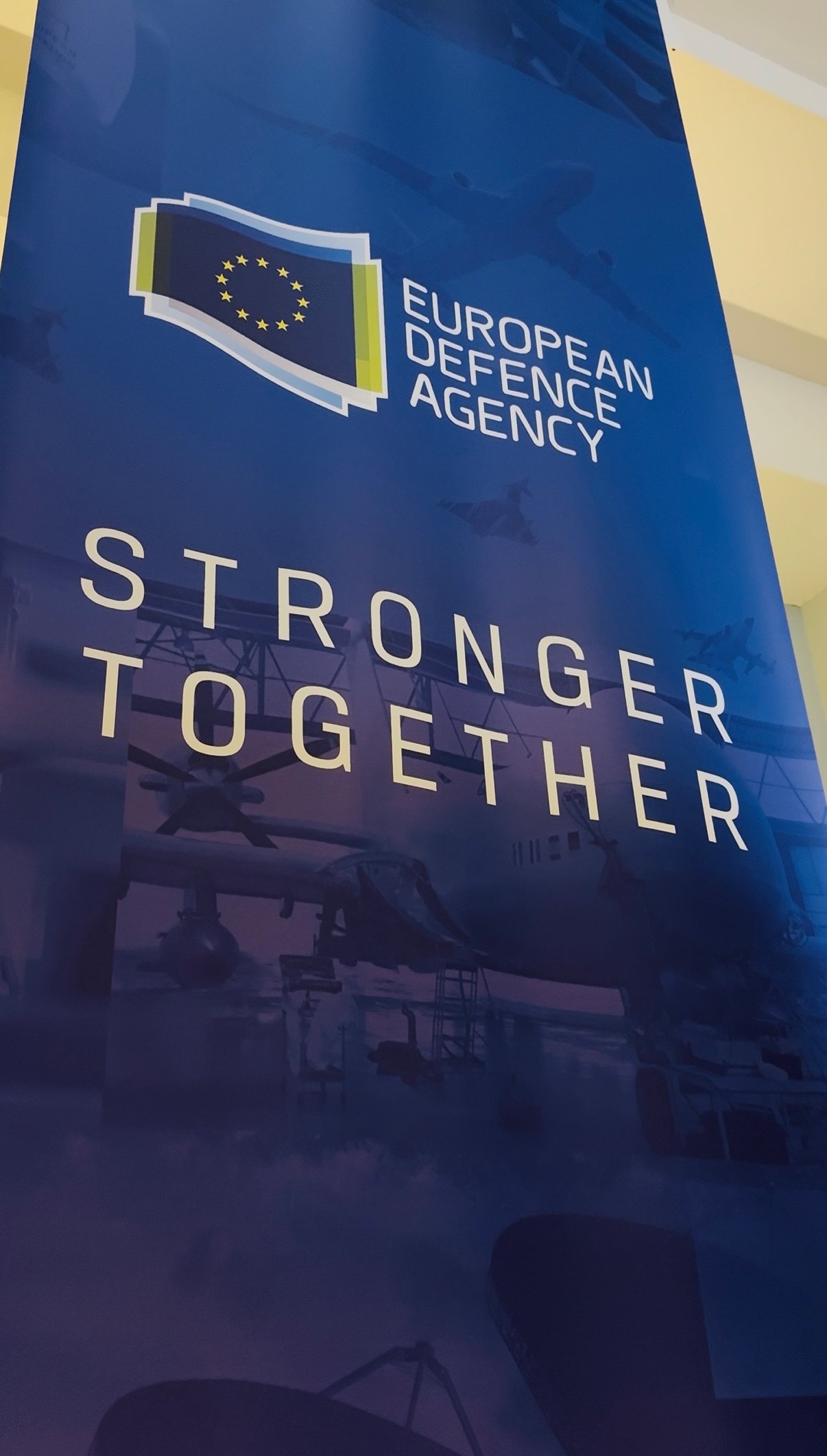 A poster with the European Defence Agency logo and moto: stronger together